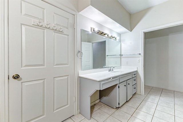 bathroom with tile patterned floors and vanity