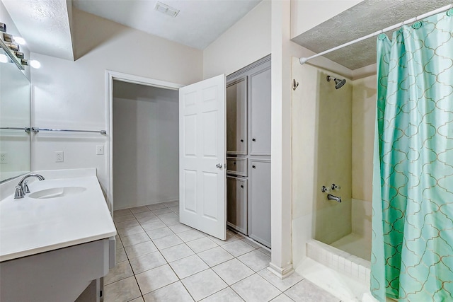 bathroom with tile patterned flooring, a shower with curtain, and vanity