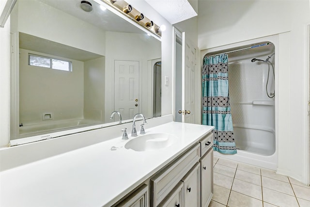 bathroom with a shower with curtain, vanity, and tile patterned floors