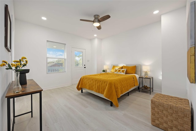 bedroom with light hardwood / wood-style floors and ceiling fan