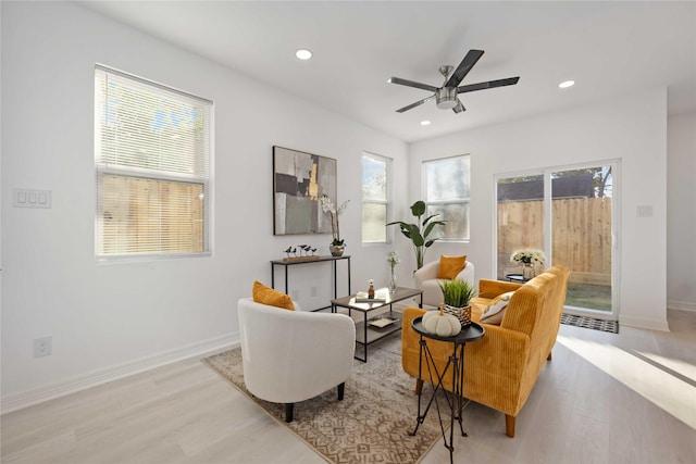 sitting room with light hardwood / wood-style flooring and ceiling fan