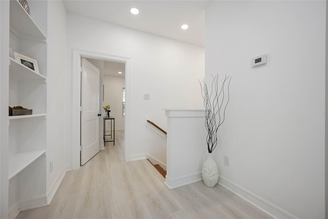 corridor featuring light hardwood / wood-style floors