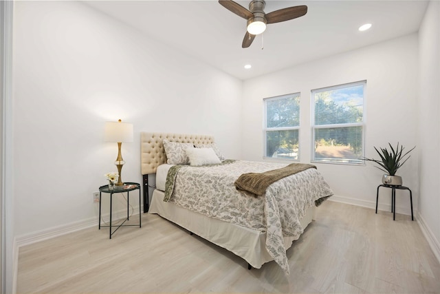 bedroom with ceiling fan and light wood-type flooring