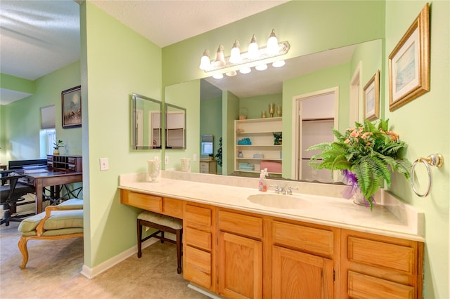 bathroom with vanity and a textured ceiling