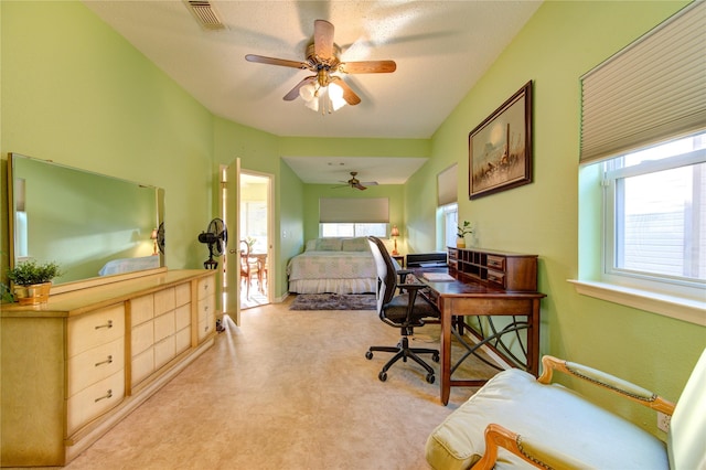 bedroom featuring ceiling fan and a textured ceiling