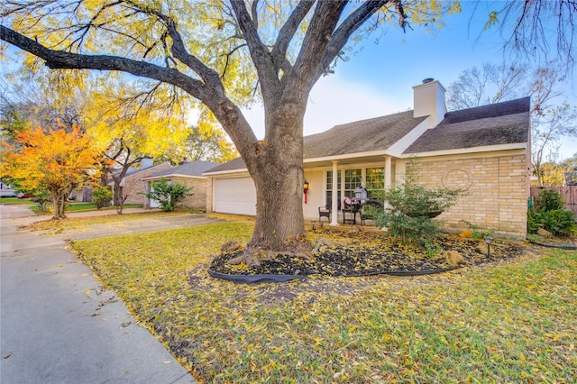 ranch-style house with a front yard and a garage