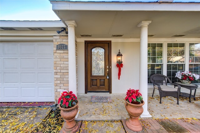 doorway to property with covered porch