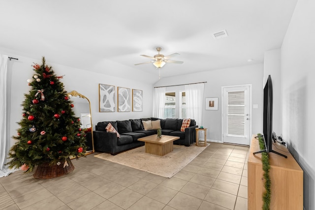 living room featuring ceiling fan and light tile patterned flooring