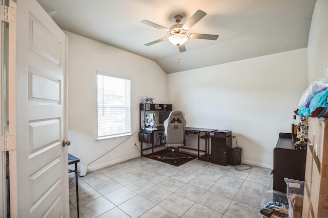 misc room featuring ceiling fan, light tile patterned floors, and vaulted ceiling