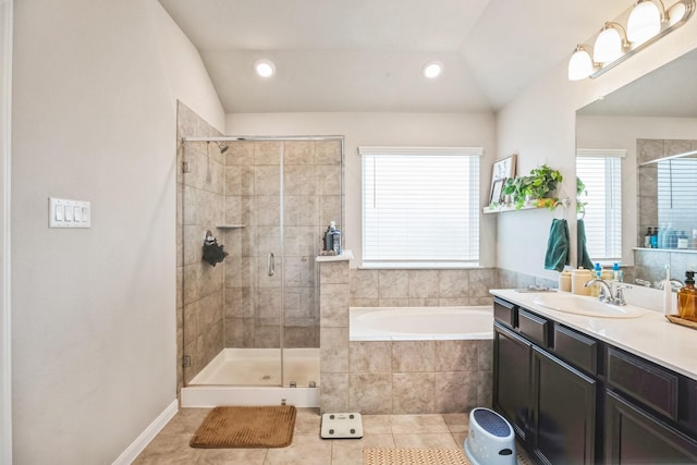 bathroom featuring tile patterned flooring, vanity, plus walk in shower, and vaulted ceiling