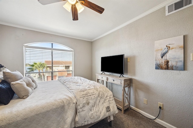 bedroom with carpet flooring, ceiling fan, and crown molding