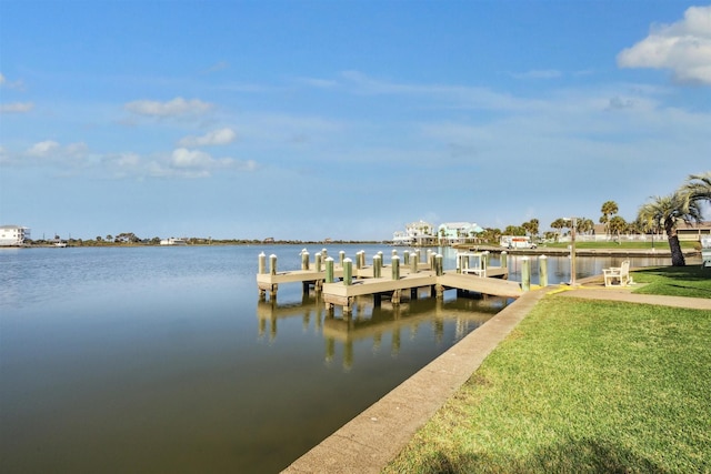 view of dock featuring a yard and a water view