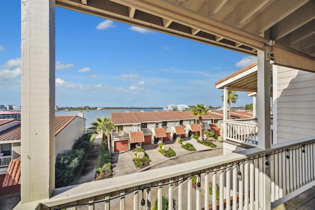 balcony featuring a water view