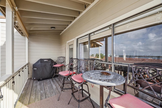 wooden deck featuring area for grilling