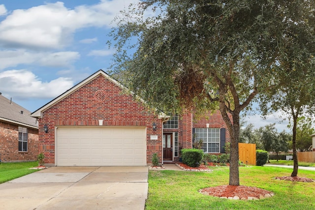 view of property with a garage and a front lawn