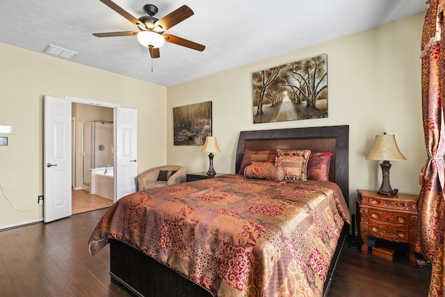 bedroom with ensuite bath, ceiling fan, and dark hardwood / wood-style floors