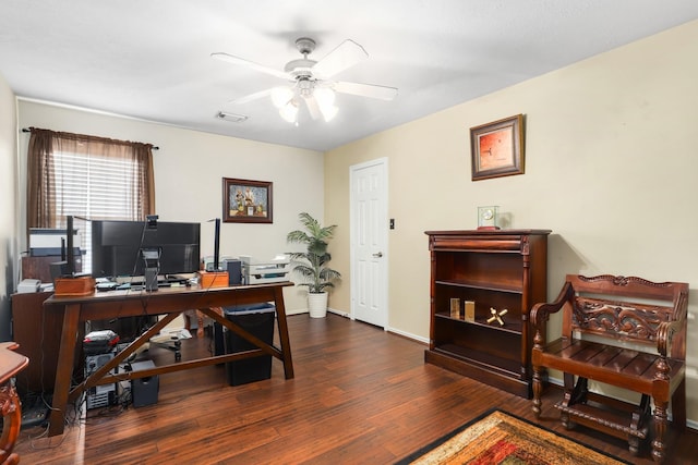 home office with dark hardwood / wood-style floors and ceiling fan