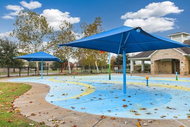 view of community featuring a playground and basketball court