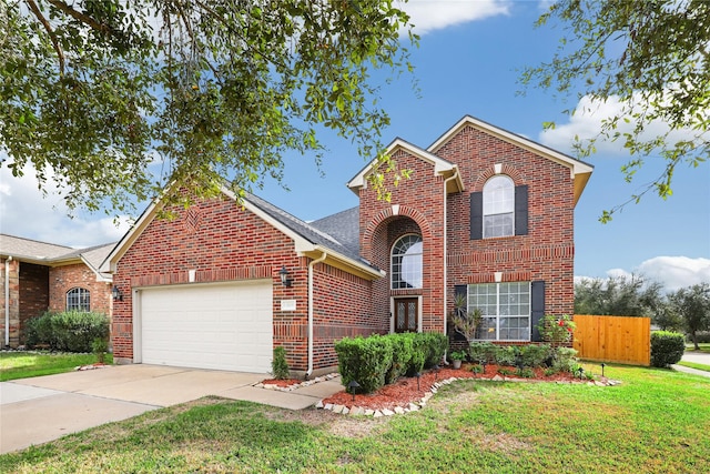 view of property with a front lawn and a garage