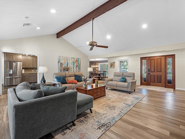 living room featuring ceiling fan, light hardwood / wood-style floors, beam ceiling, and high vaulted ceiling