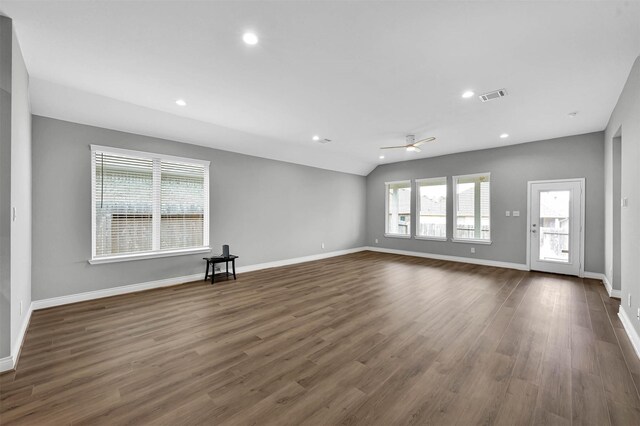 unfurnished living room with lofted ceiling, ceiling fan, and dark hardwood / wood-style floors