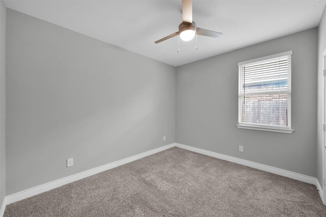 spare room featuring carpet flooring and ceiling fan