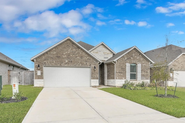 view of front of home with a front yard and a garage