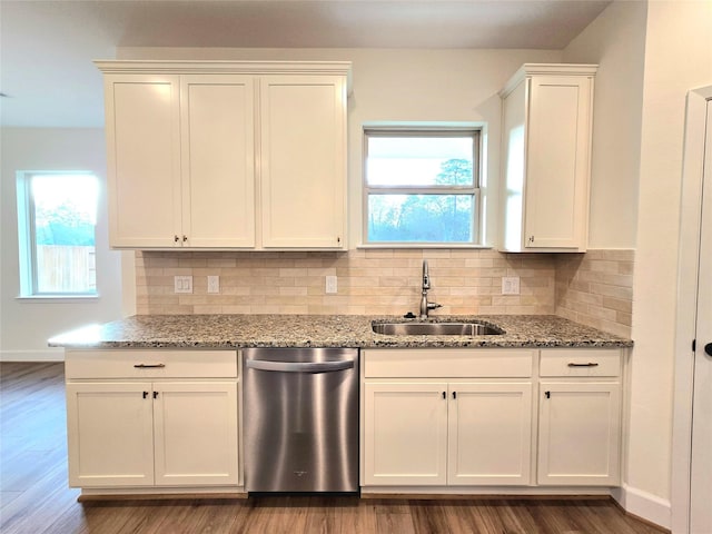 kitchen with dishwasher, a healthy amount of sunlight, dark hardwood / wood-style floors, and sink