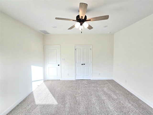 carpeted empty room with ceiling fan