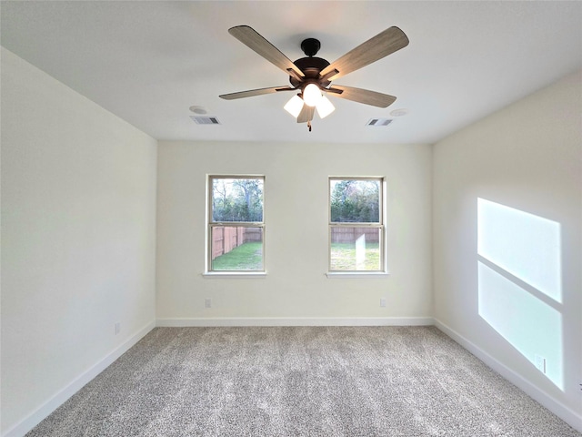 carpeted empty room with ceiling fan