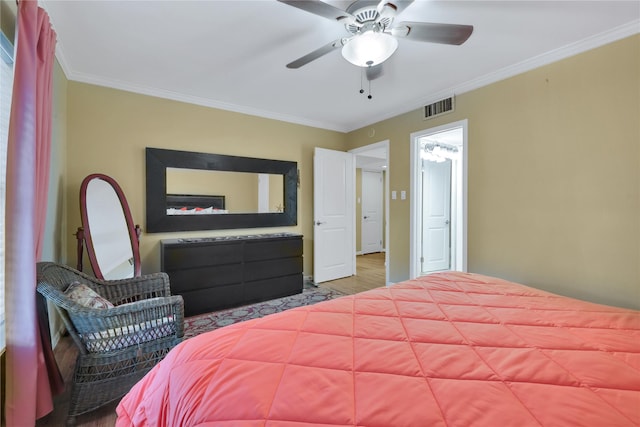 bedroom featuring crown molding, ceiling fan, and hardwood / wood-style flooring