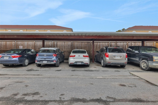2824 Briarhurst Dr Unit 12, Houston, TX 77057 - covered parking lot featuring fence