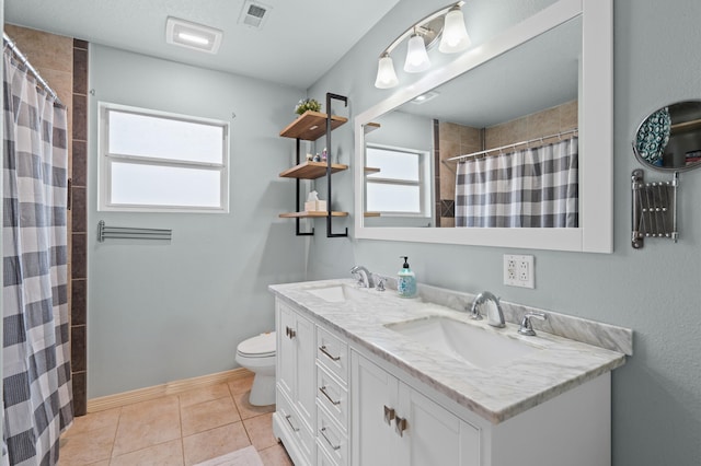 bathroom featuring tile patterned floors, vanity, toilet, and a shower with shower curtain