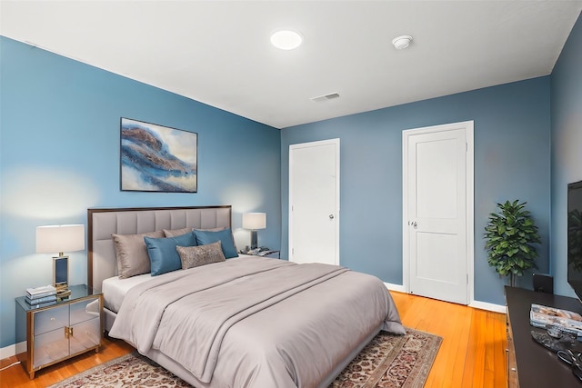 bedroom with light hardwood / wood-style flooring