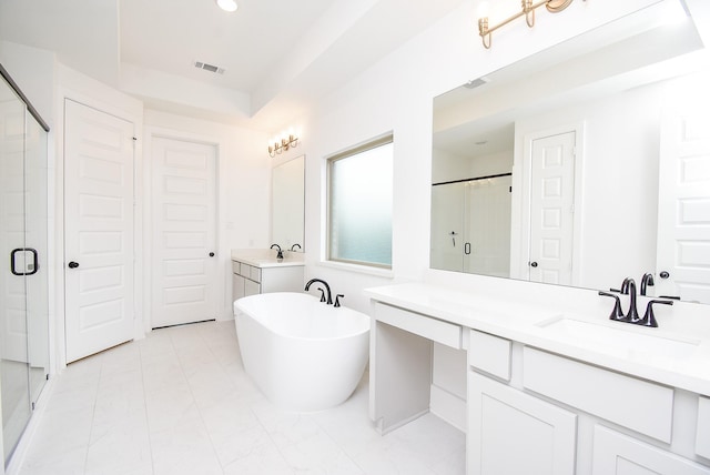 bathroom with vanity and independent shower and bath