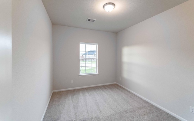 empty room with carpet flooring