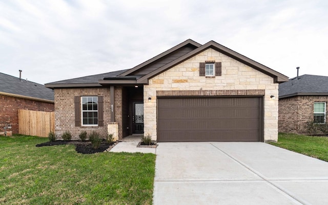 view of front facade featuring a front yard and a garage