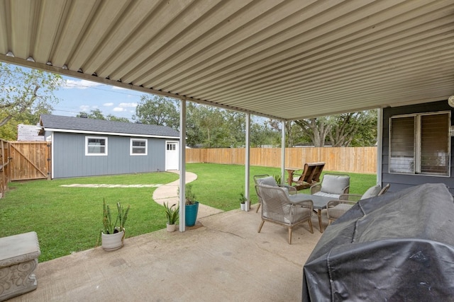 view of patio / terrace with an outbuilding