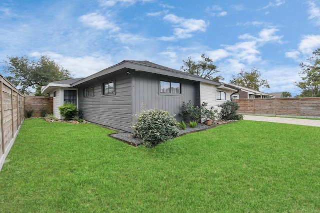 view of home's exterior featuring a lawn