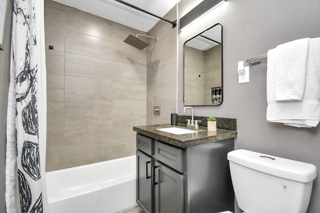 full bathroom with vanity, shower / bath combination with curtain, and toilet