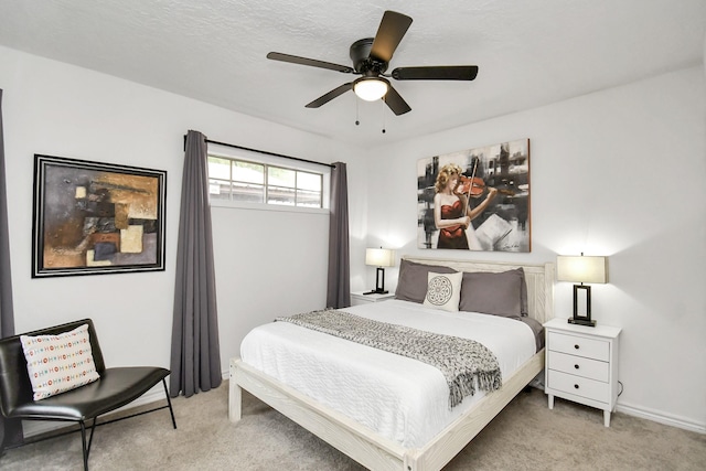 bedroom featuring ceiling fan and light carpet