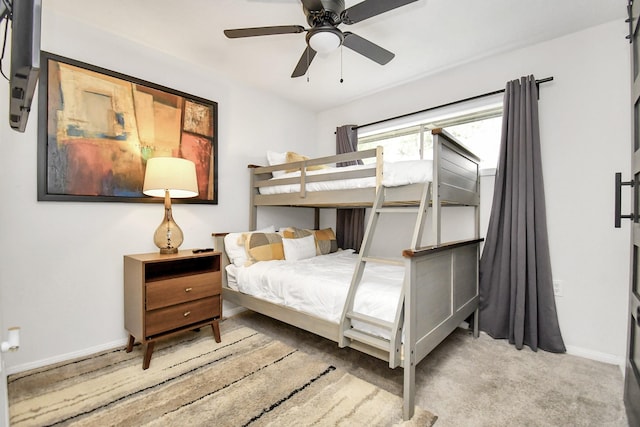 bedroom with light carpet and ceiling fan