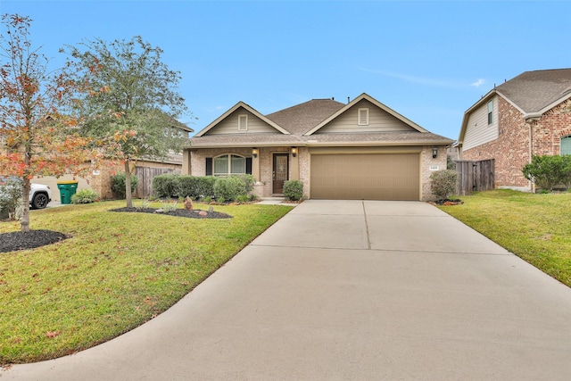 view of front of house featuring a front yard and a garage