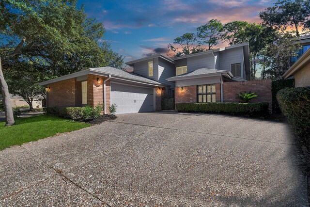 view of front of property with a garage