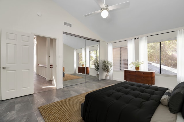 bedroom featuring ceiling fan, vaulted ceiling, radiator, and a closet