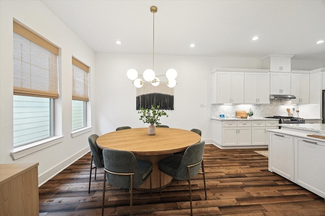 dining area with dark hardwood / wood-style flooring