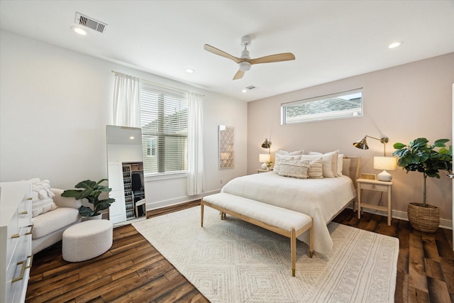 bedroom with ceiling fan and dark hardwood / wood-style floors