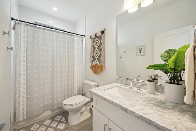 bathroom featuring tile patterned flooring, vanity, curtained shower, and toilet