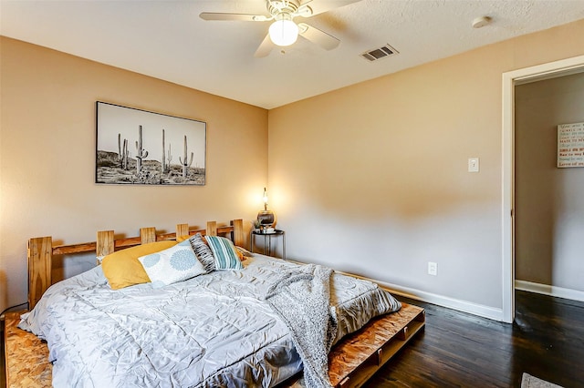 bedroom featuring dark hardwood / wood-style flooring and ceiling fan