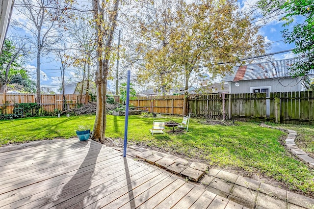 wooden deck with a lawn